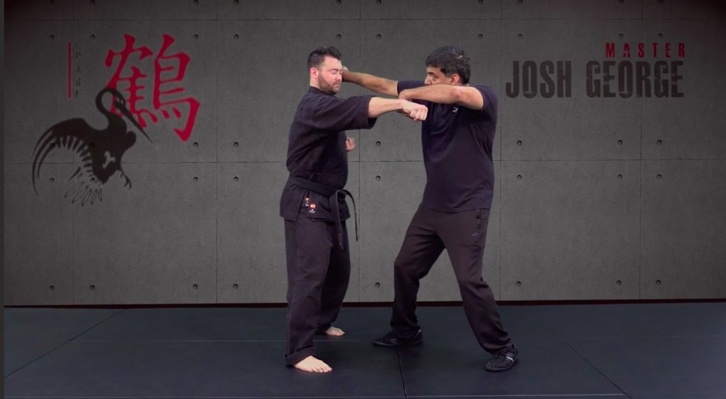 Joshua T. George demonstrating a block and counterstrike in the studio
